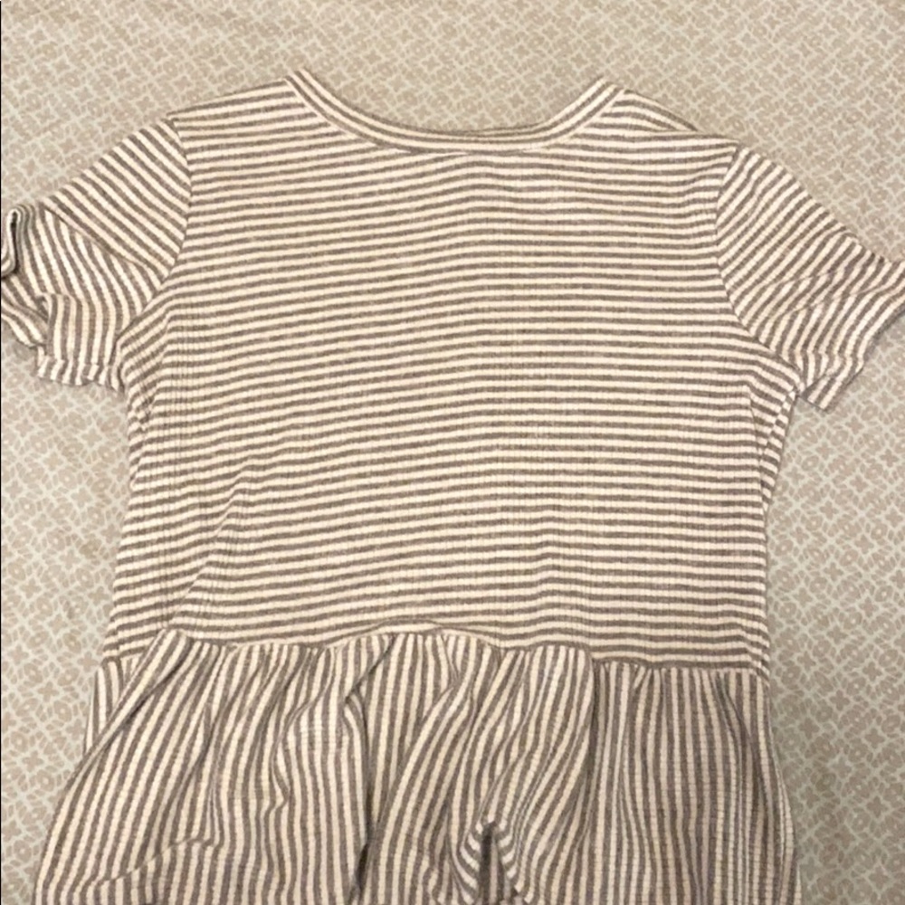 A pretty shirt with cute ruffles at the end